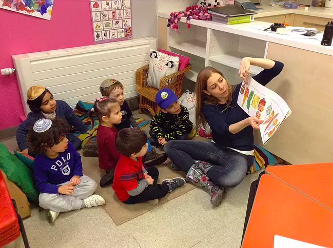 The children learning The Very Hungry Caterpillar